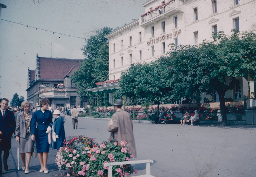 a group of people walking on a street