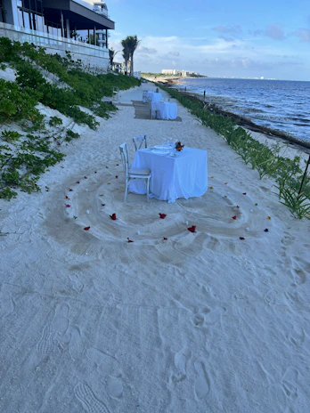 A cozy beachfront villa set up for an intimate event with elegant decorations.