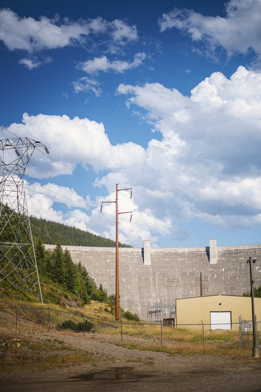 a building with a tower and power lines in front of it