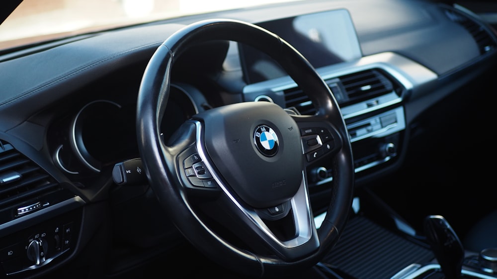 the steering wheel and dashboard of a car