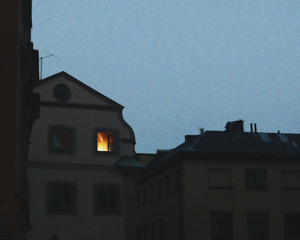 a couple of buildings with a light on top