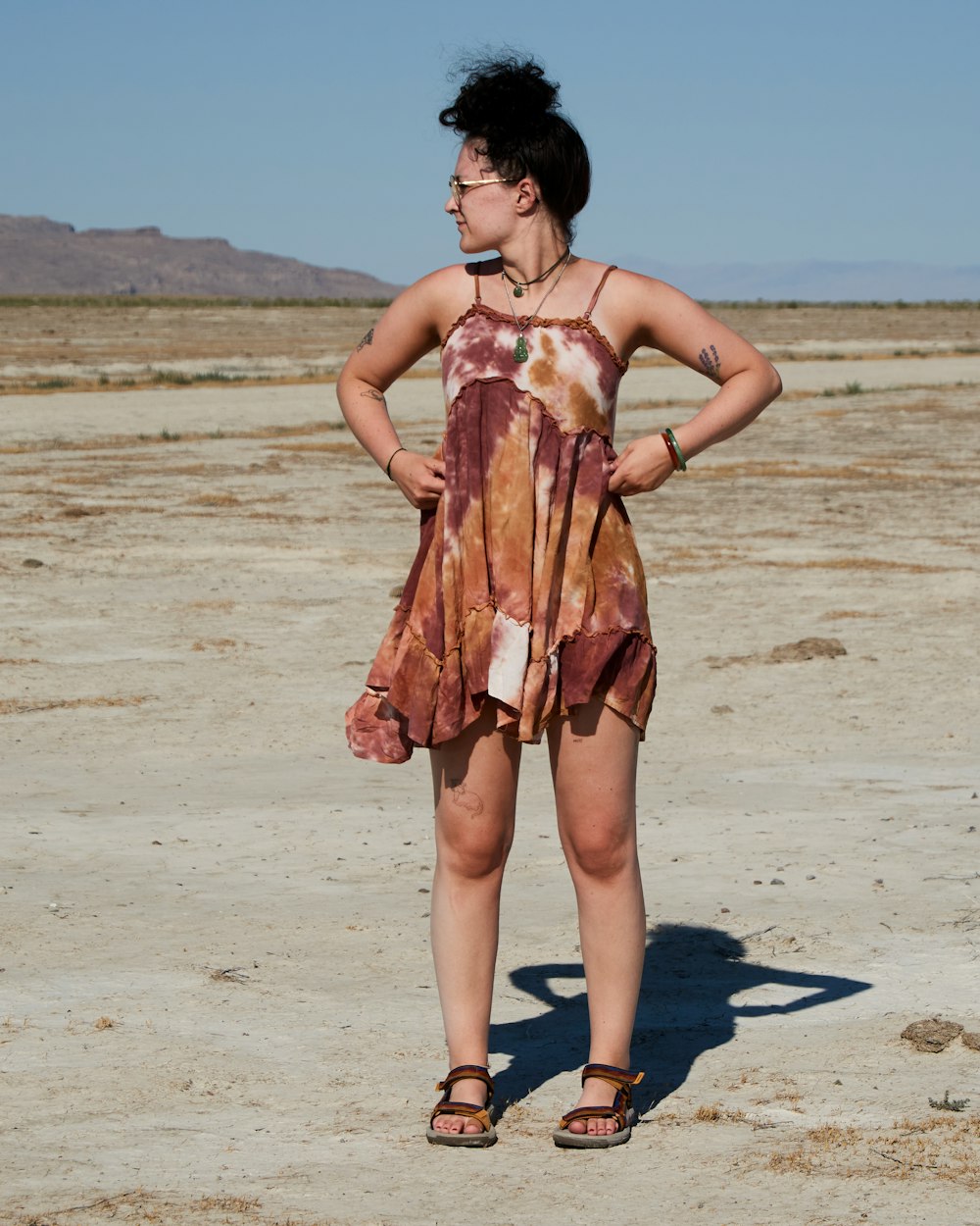 a man in a dress on a beach