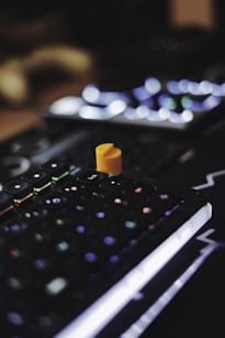 a small orange toy on a keyboard