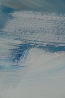 An artistic close-up of brushstrokes on a commissioned canvas.