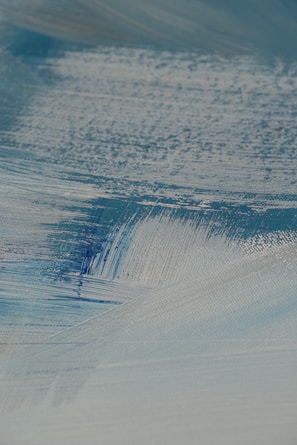 An artistic close-up of brushstrokes on a commissioned canvas.