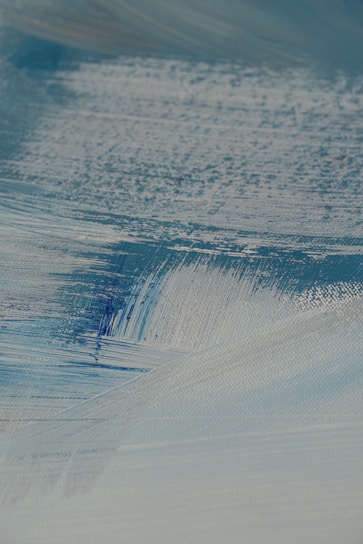 Close-up of textured canvas showing detailed paint layers and strokes.