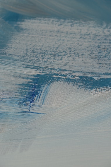 A close-up of a finely detailed handmade wall art piece showcasing delicate brush strokes and rich textures.