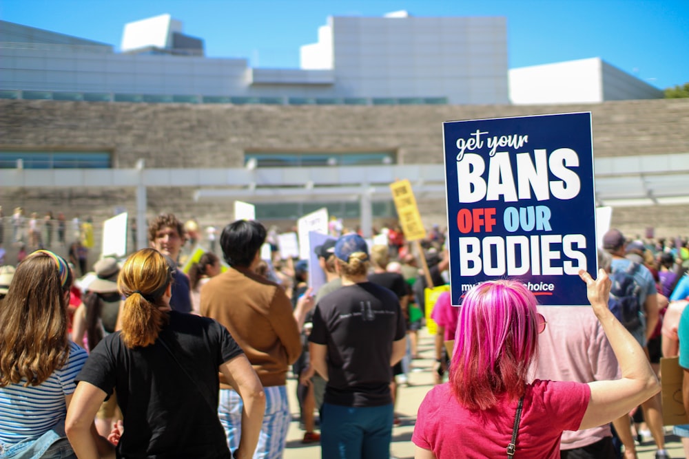 a group of people holding signs