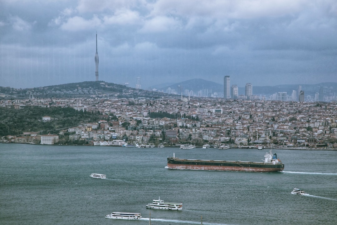 a large ship in the water with a city in the background, Mighty Istanbul, Gorgeous Bosphorus