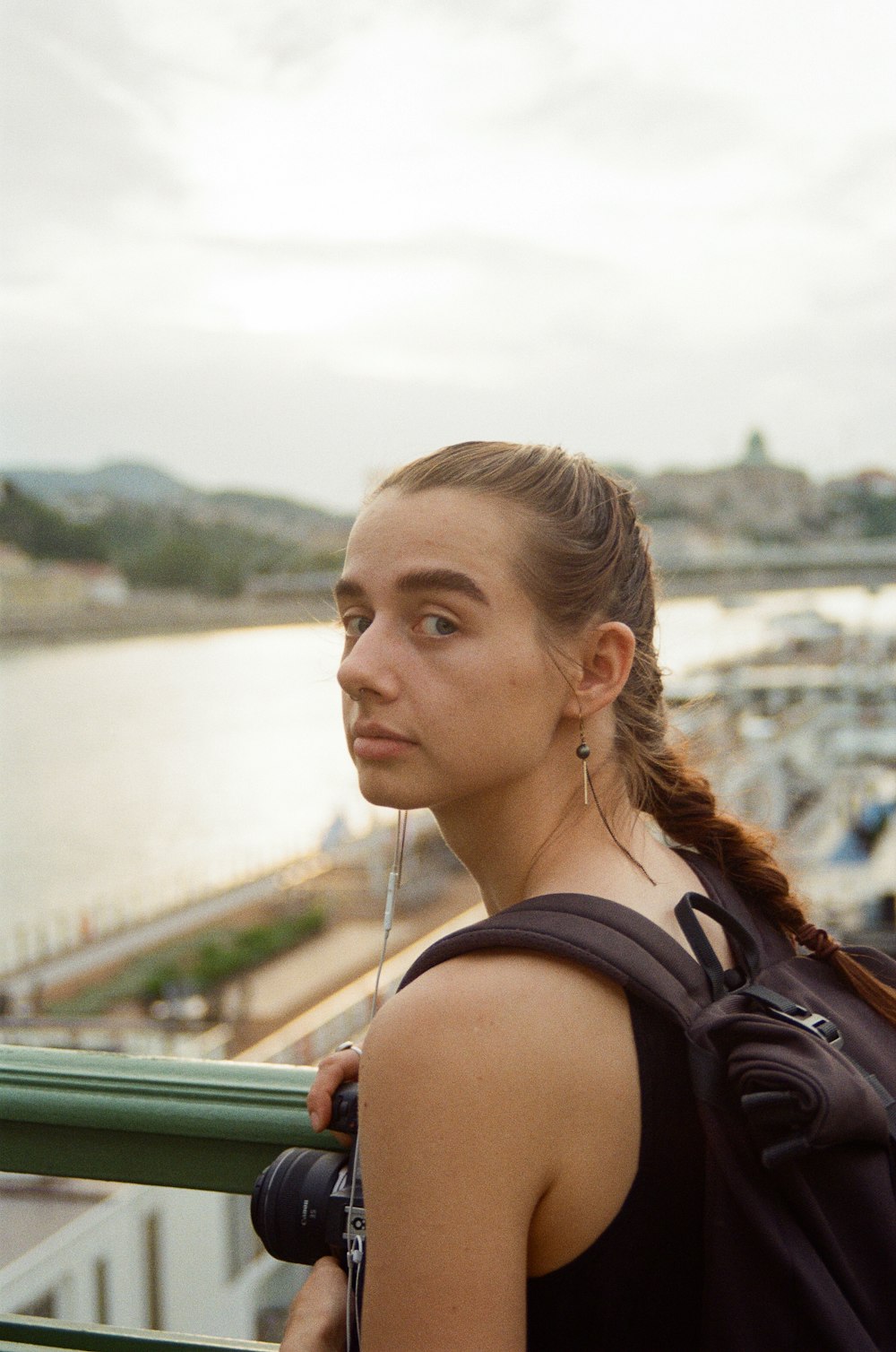 a woman looking over a railing