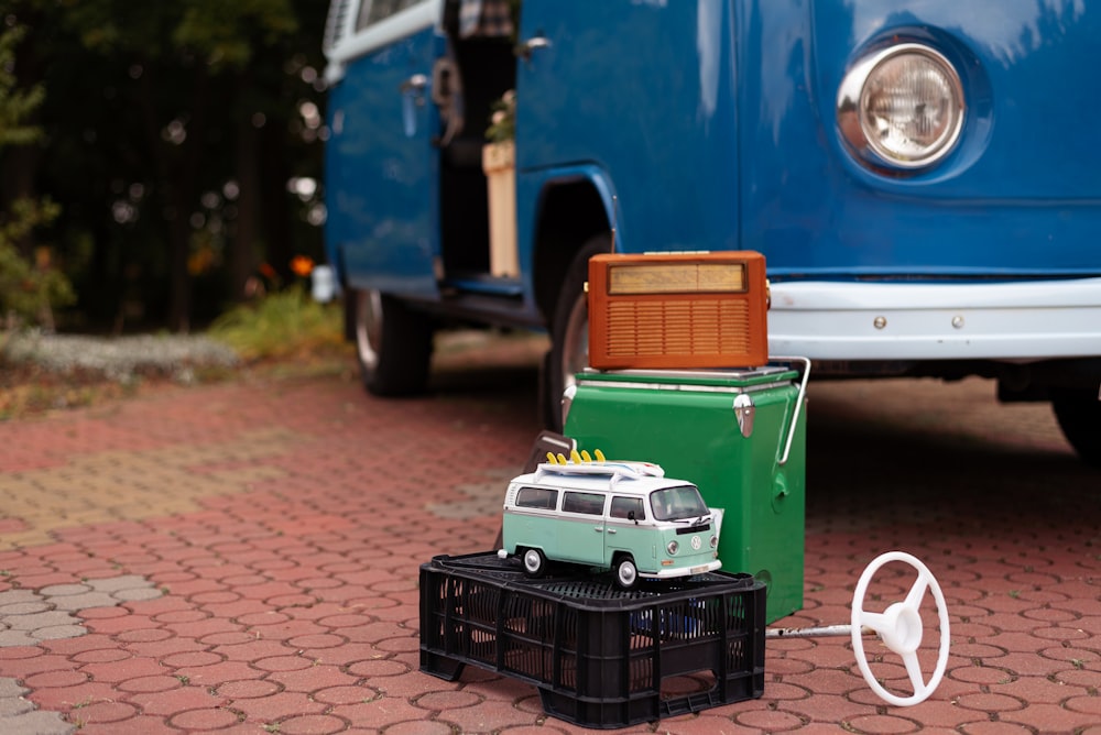 a blue truck with a green cart