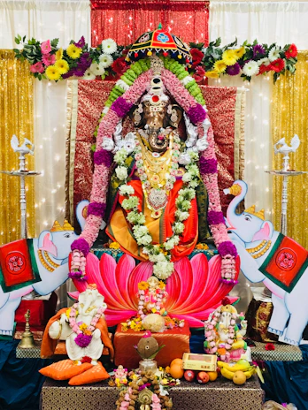 Devotees offering vibrant flowers and sacred items at the temple altar.