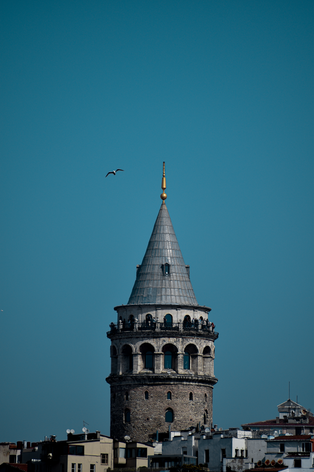 a large building towers over a city