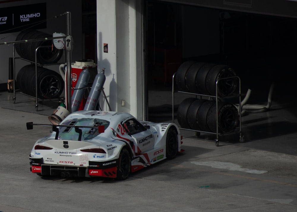 a race car with a large stack of tires on top of it