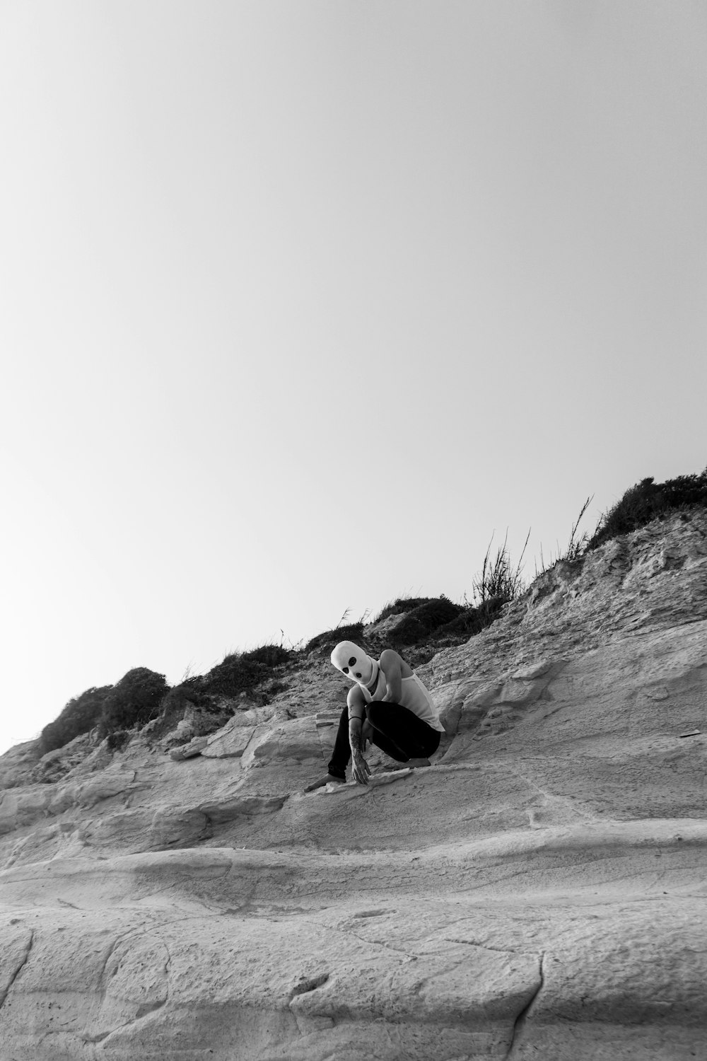 a man sitting on a rock