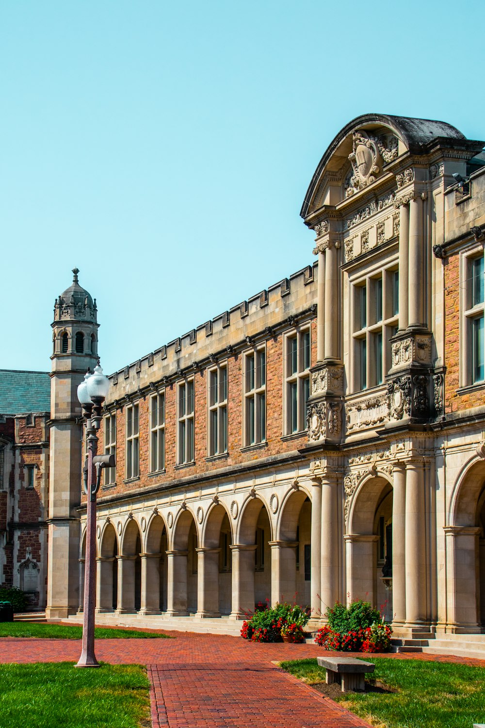 a large building with a brick walkway