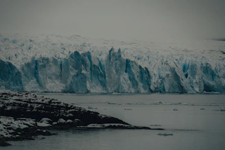 Contrast of a glacial landscape meeting tropical blue waters in a dreamlike panorama.