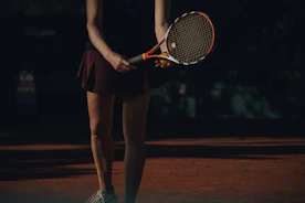 a woman holding a tennis racket