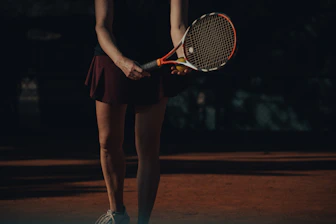 a woman holding a tennis racket
