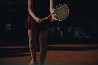 a woman holding a tennis racket