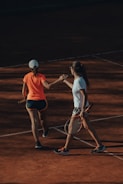 a couple of women playing tennis