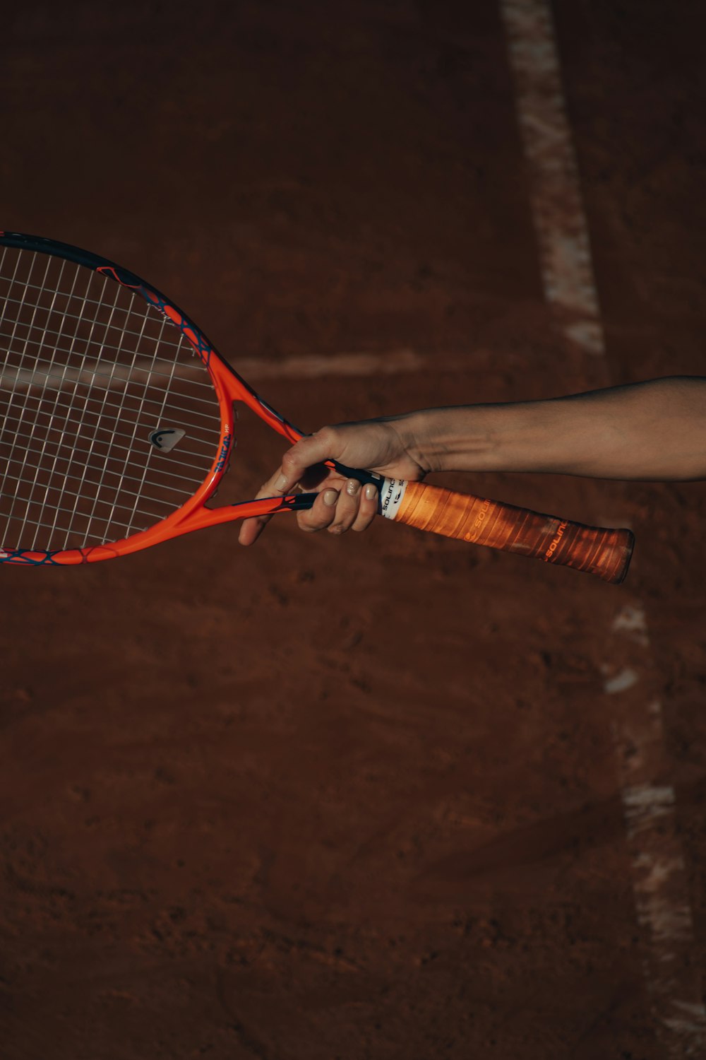 a person holds a tennis racket