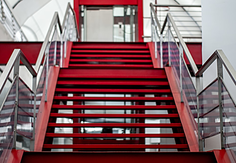 a red staircase with metal railings