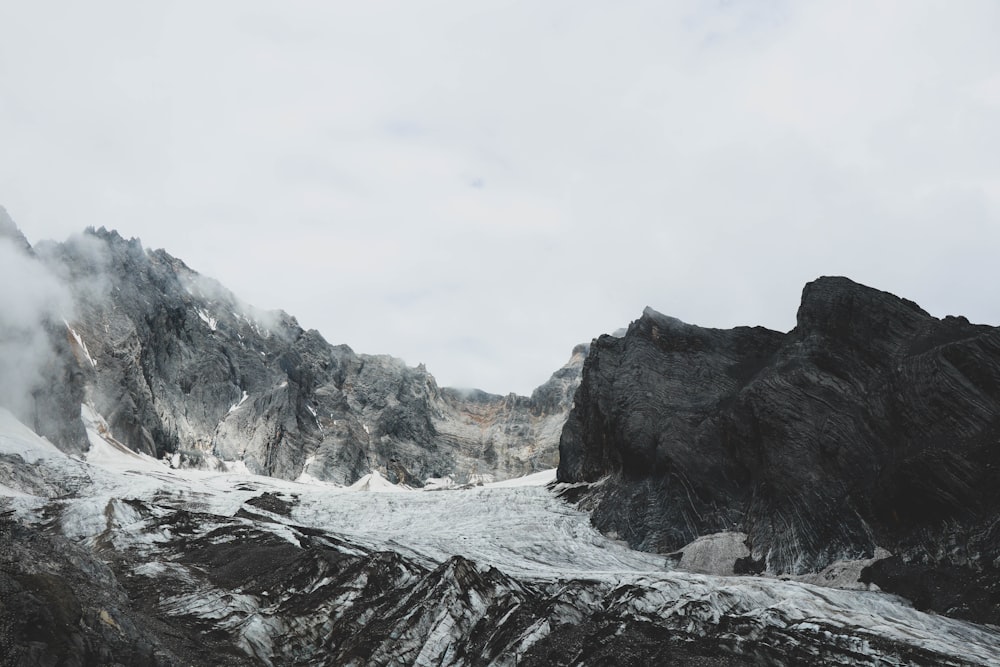 a rocky mountain with snow