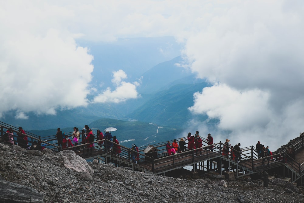 a group of people on a bridge