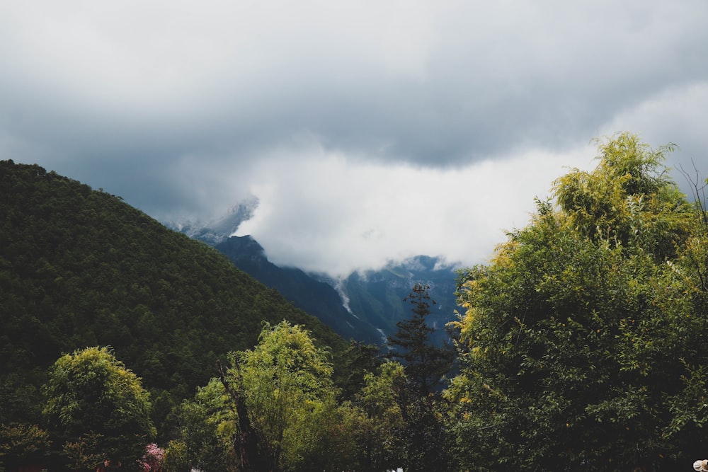 a view of a mountain range with clouds in the sky