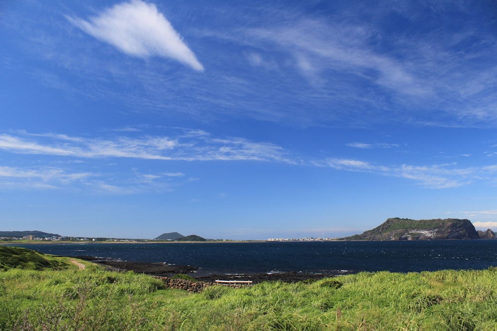 a body of water with land in the back