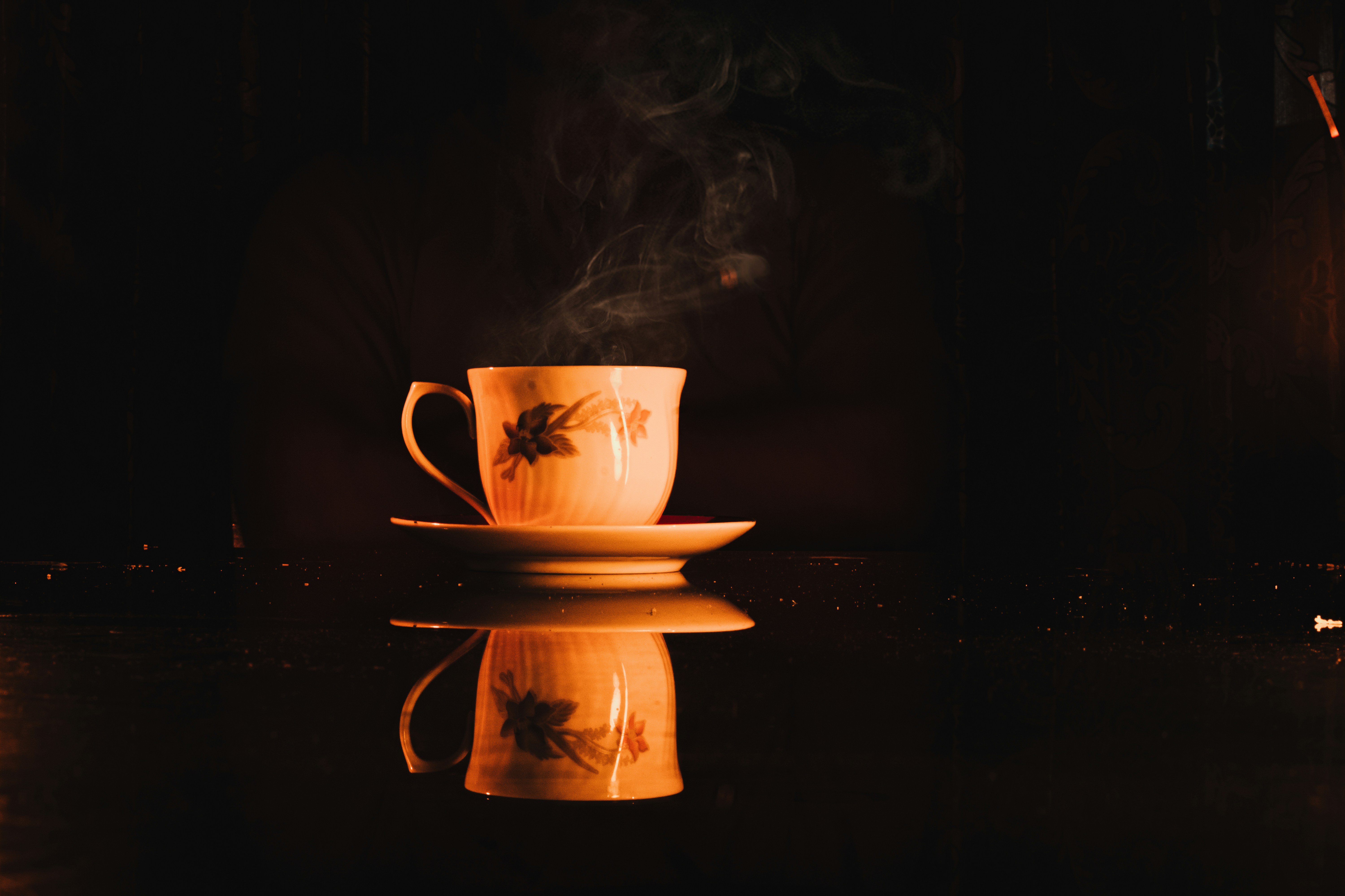 a cup of coffee with smoke