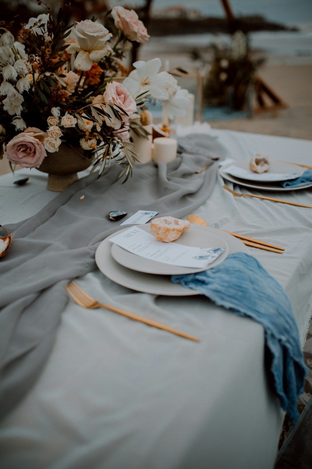 a table with plates and flowers