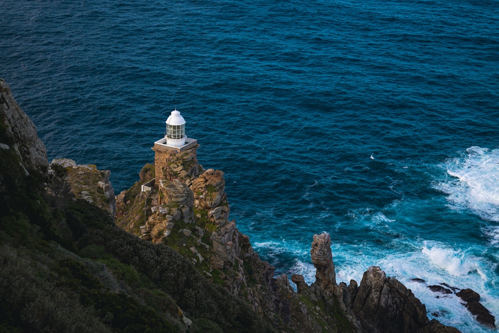 a lighthouse on a rocky cliff