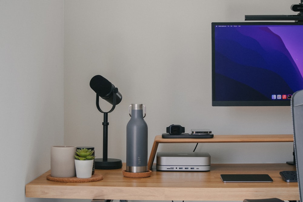 a shelf with a tv and a lamp on it