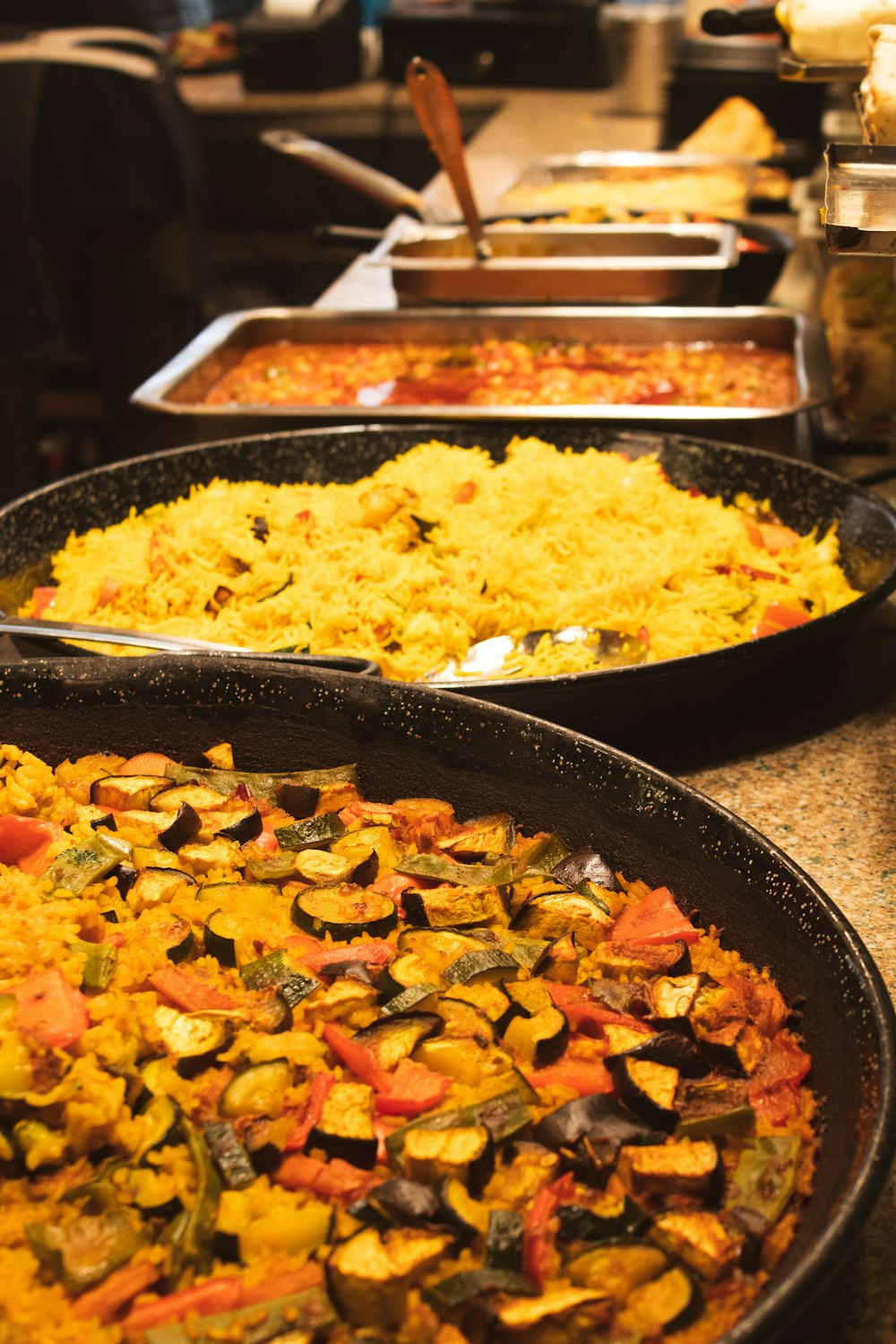 a couple of pans full of food on a stove