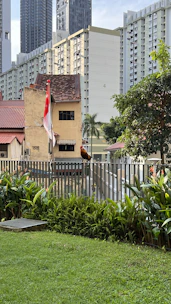 A lively collage of different pets including dogs, cats, and birds with vibrant orange, red, and black backgrounds reflecting Singapore’s energetic vibe.