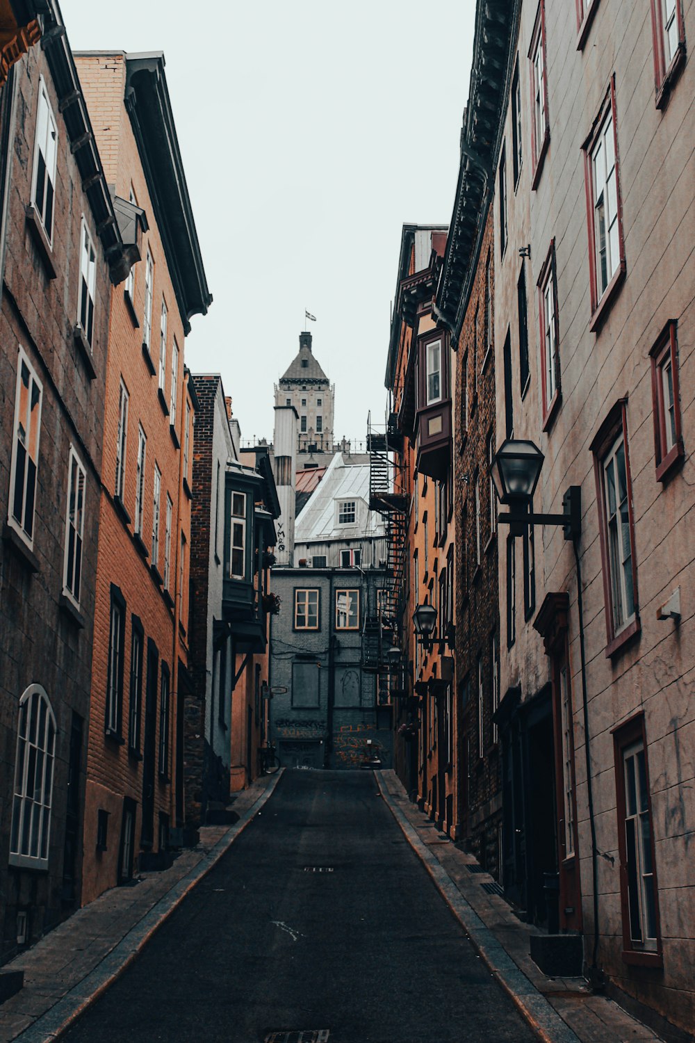 a narrow street with buildings on both sides