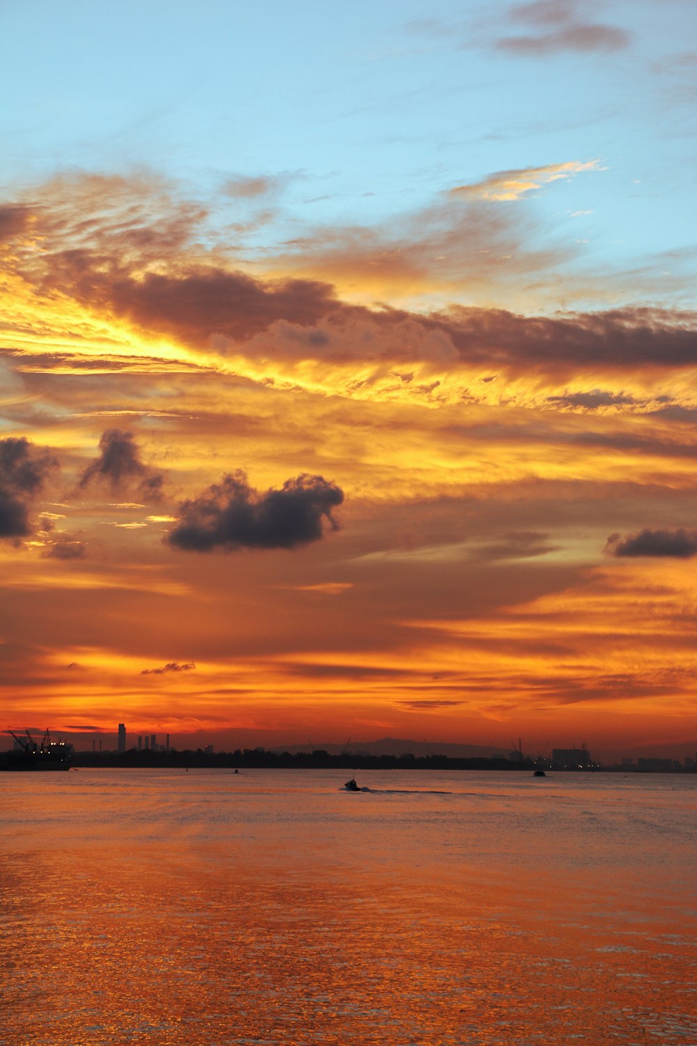 a sunset over a body of water