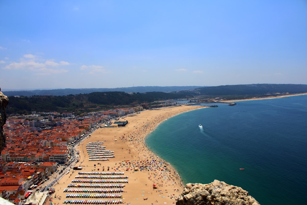 a beach with many buildings and water