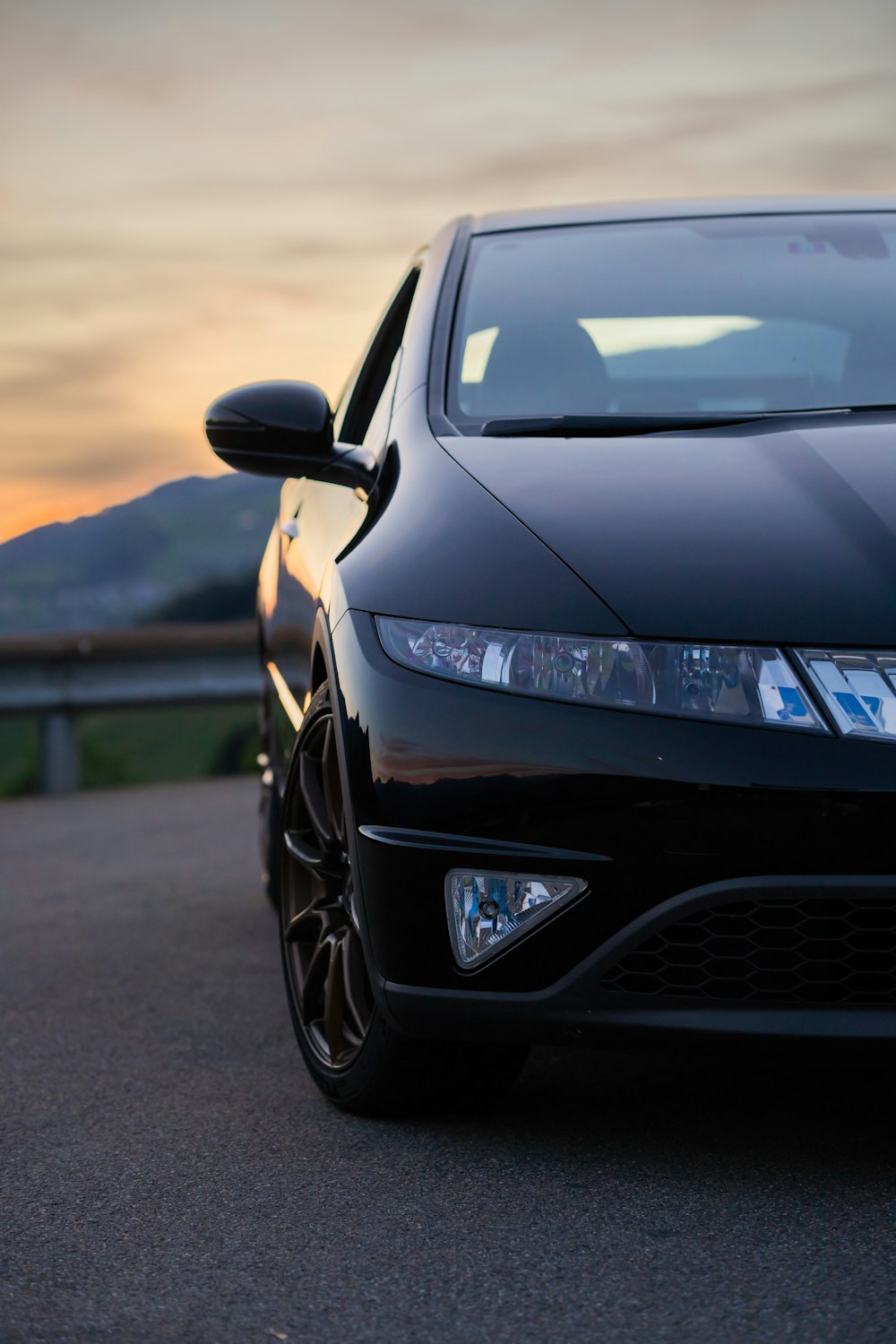 a black car parked on a road