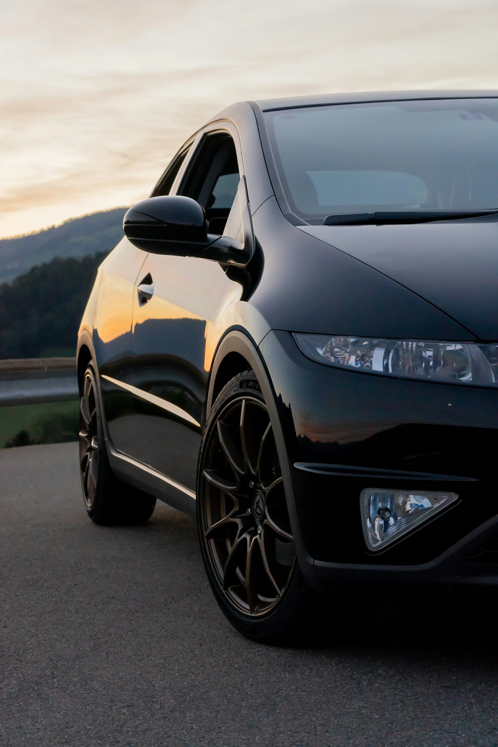 a black car parked on a road