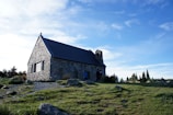 Glenbervie church standing proudly under a bright blue sky.