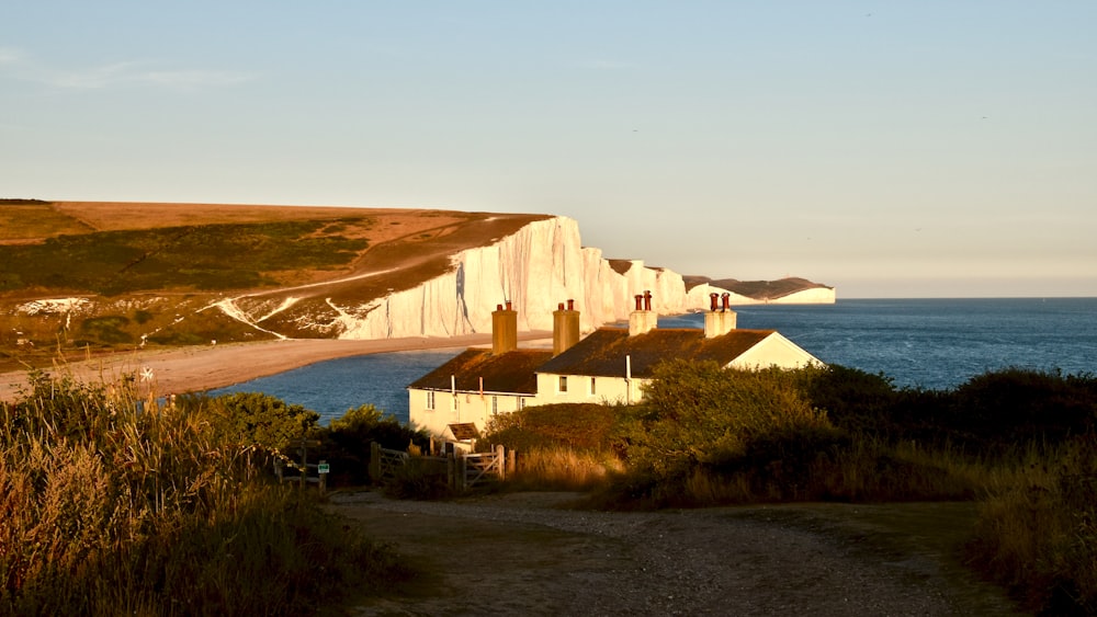 a house on a hill by the water