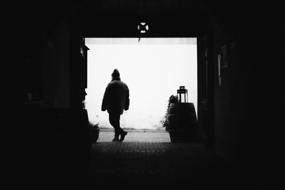 a person walking in a dark room