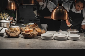 a couple of chefs preparing food