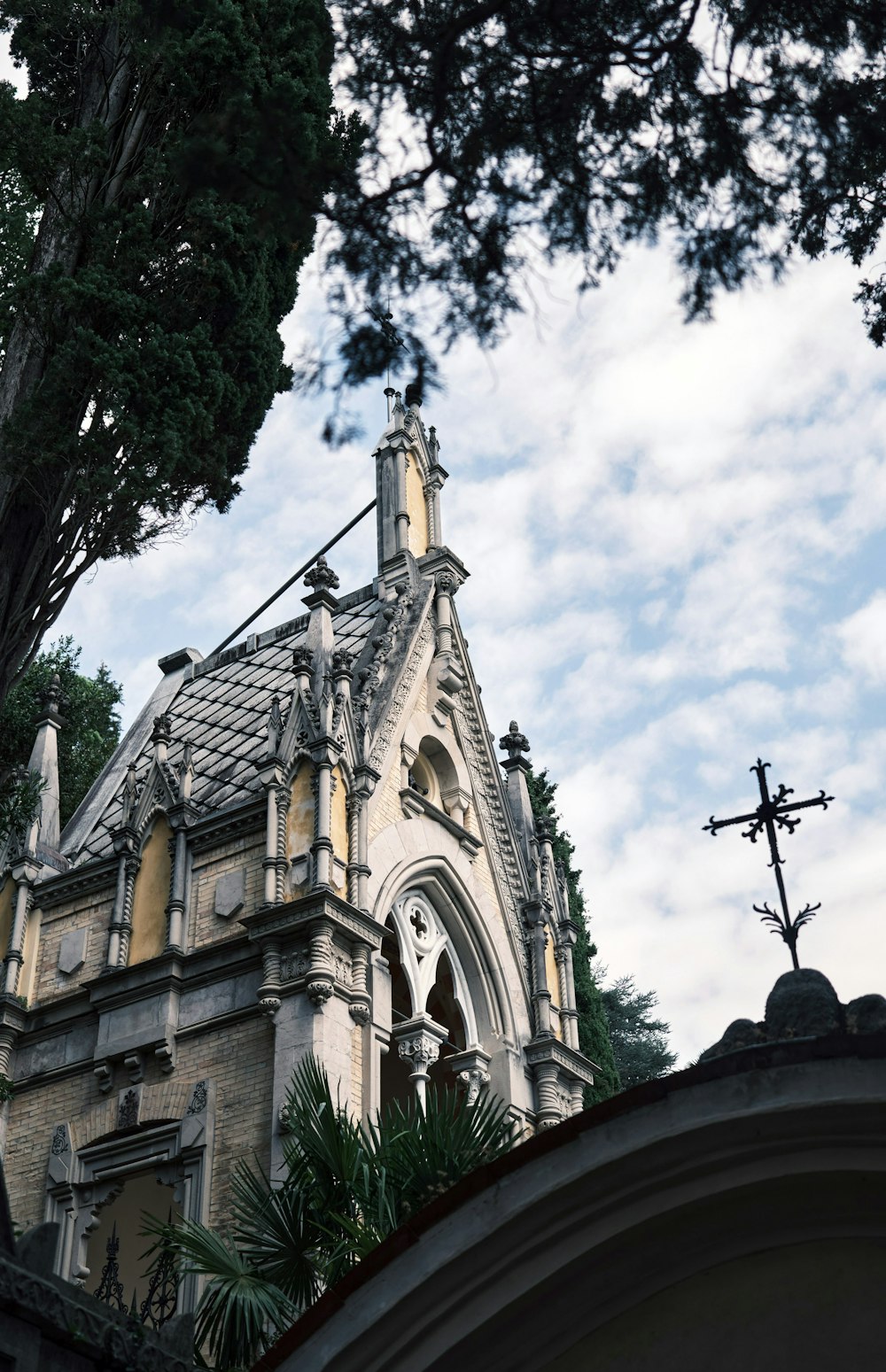 a building with a tower and a cross on top