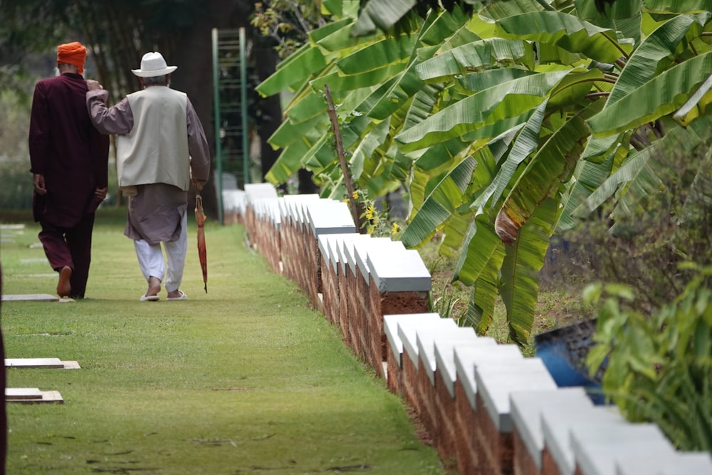 a few men walking on a path