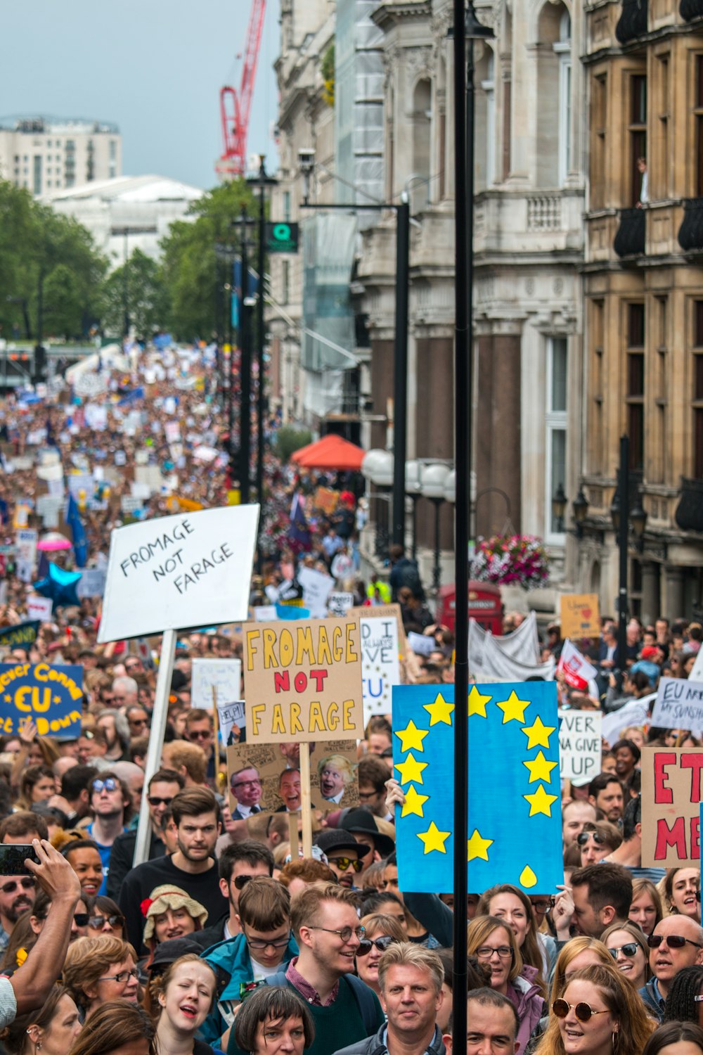 a crowd of people holding signs