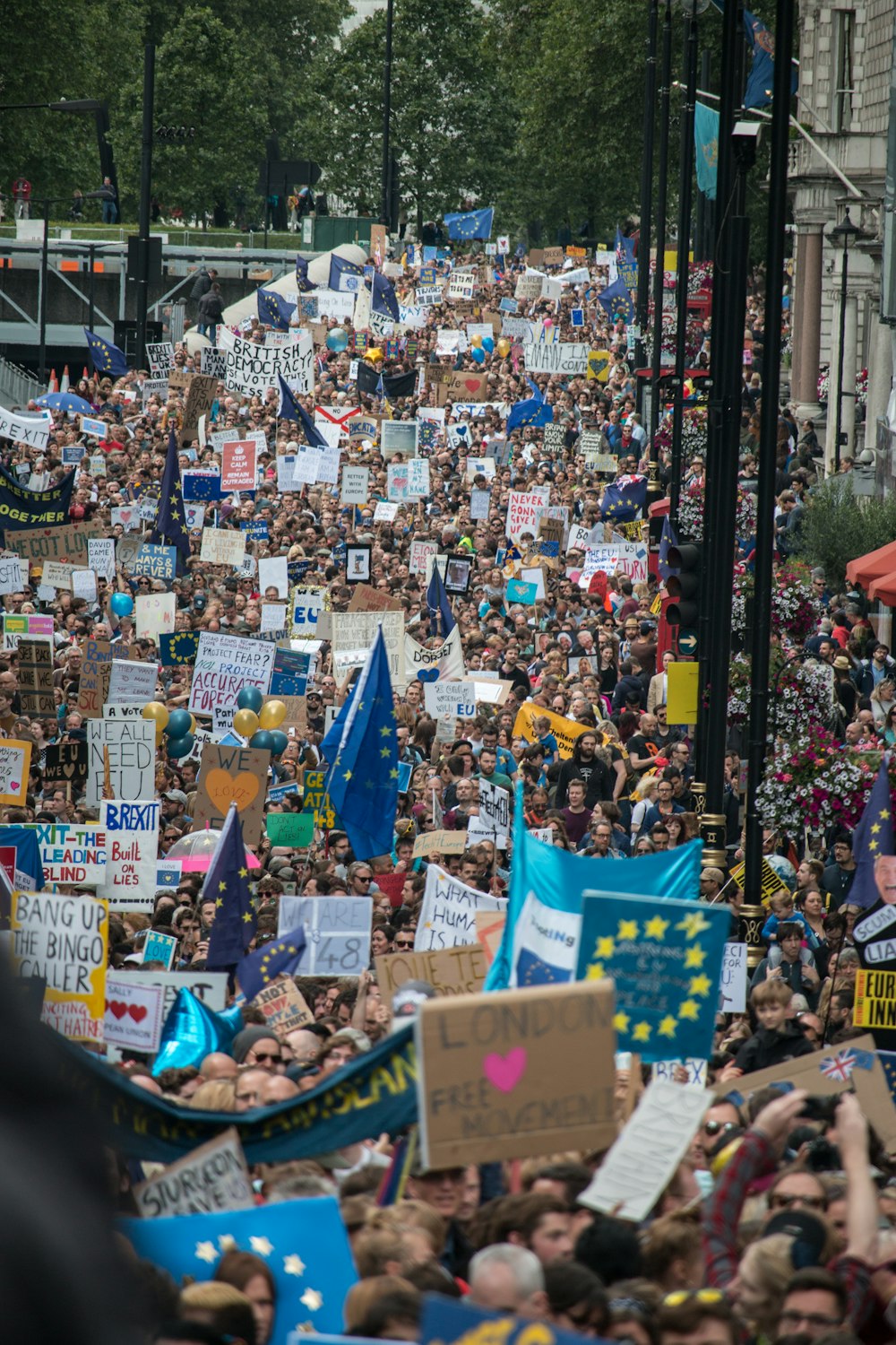 a crowd of people holding signs